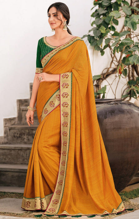 Traditional Designer Party Wear Golden Color Vichitra Silk Saree With Embroidery Border Tassal Pallu And Green Color Embroidery Blouse Piece. Apparel & Accessories Roopkashish 