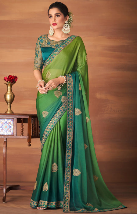 Traditional Designer Party Wear Embroidered Georgette Olive Silk Saree With Teal Net, Dupion Silk Blouse Roopkashish 