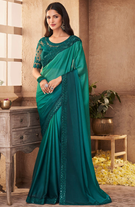 Traditional Designer Party Wear Teal Colour Georgette Saree With Sequance Work Border. Apparel & Accessories Roopkashish 